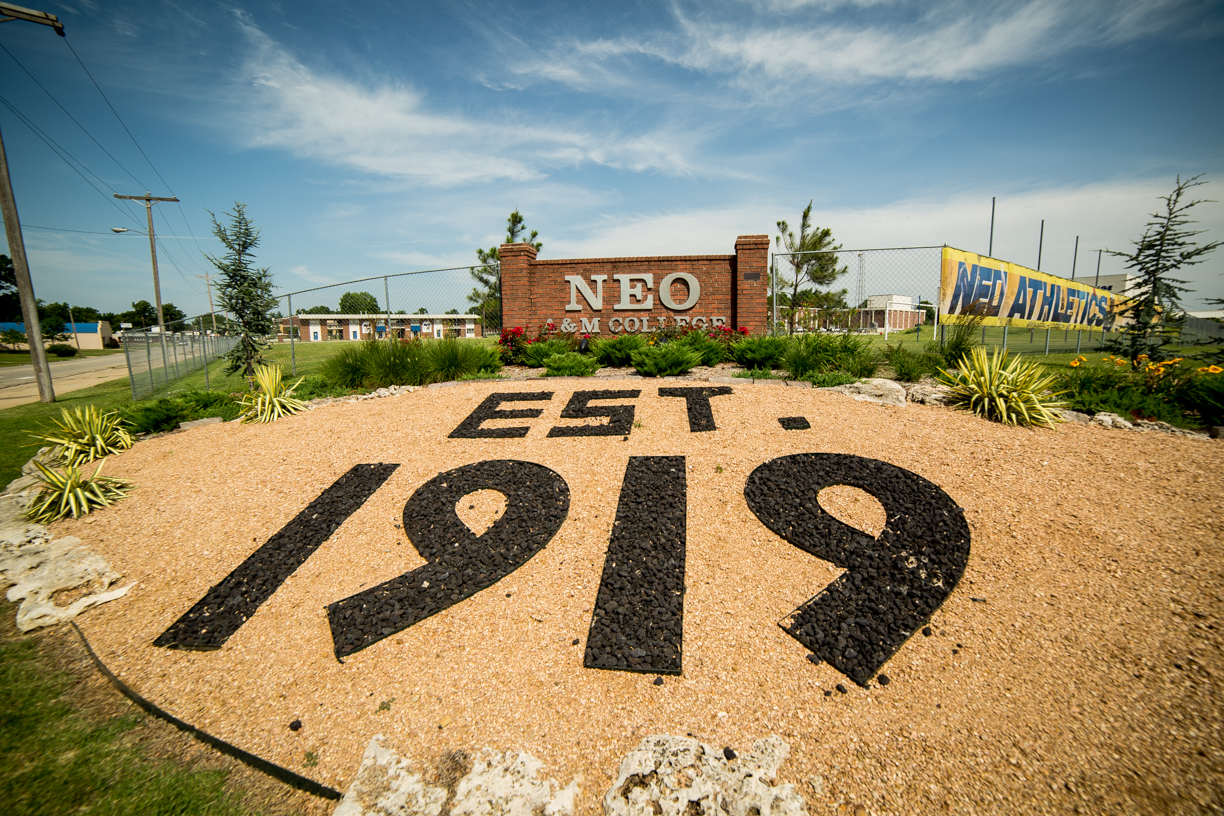 NEO college sign with landscaping arranged to say 