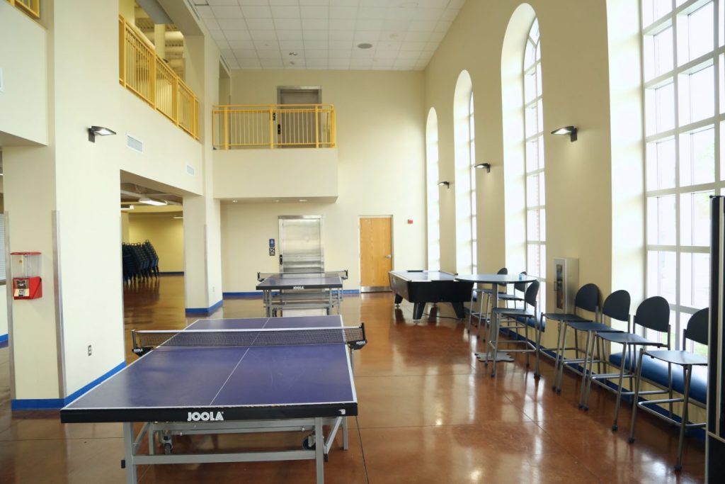 Interior of student activity center with ping pong tables