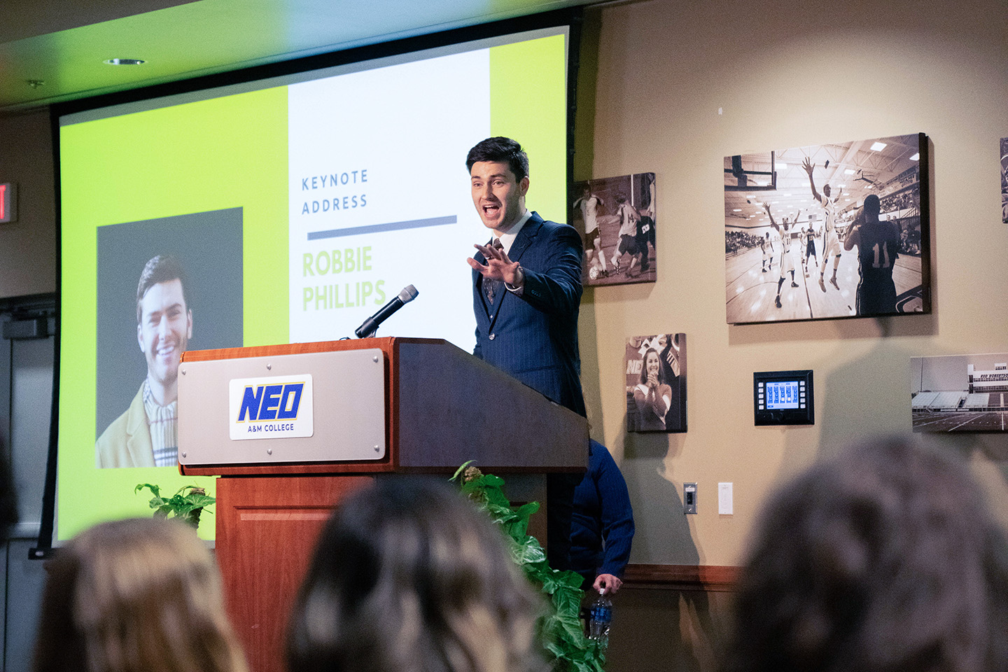 man speaking at a podium